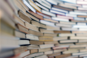 Close up of old books stacked up in a semicircle